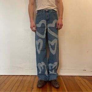 Men's Blue Denim Jeans with Bleached Heart Design